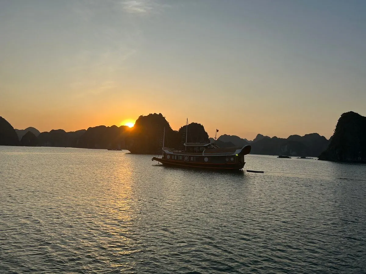Sunset cruise Lan Ha Bay golden light karsts Cat Ba Bali