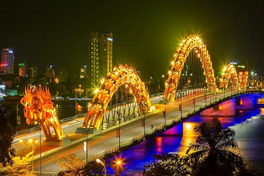 Dragon Bridge lit up at night over Han River Da Nang