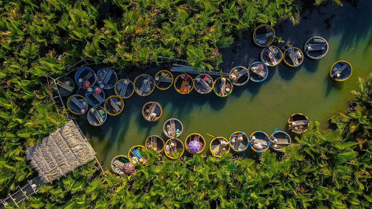Traditional basket boat ride in Bay Mau coconut palm forest Hoi An Bali