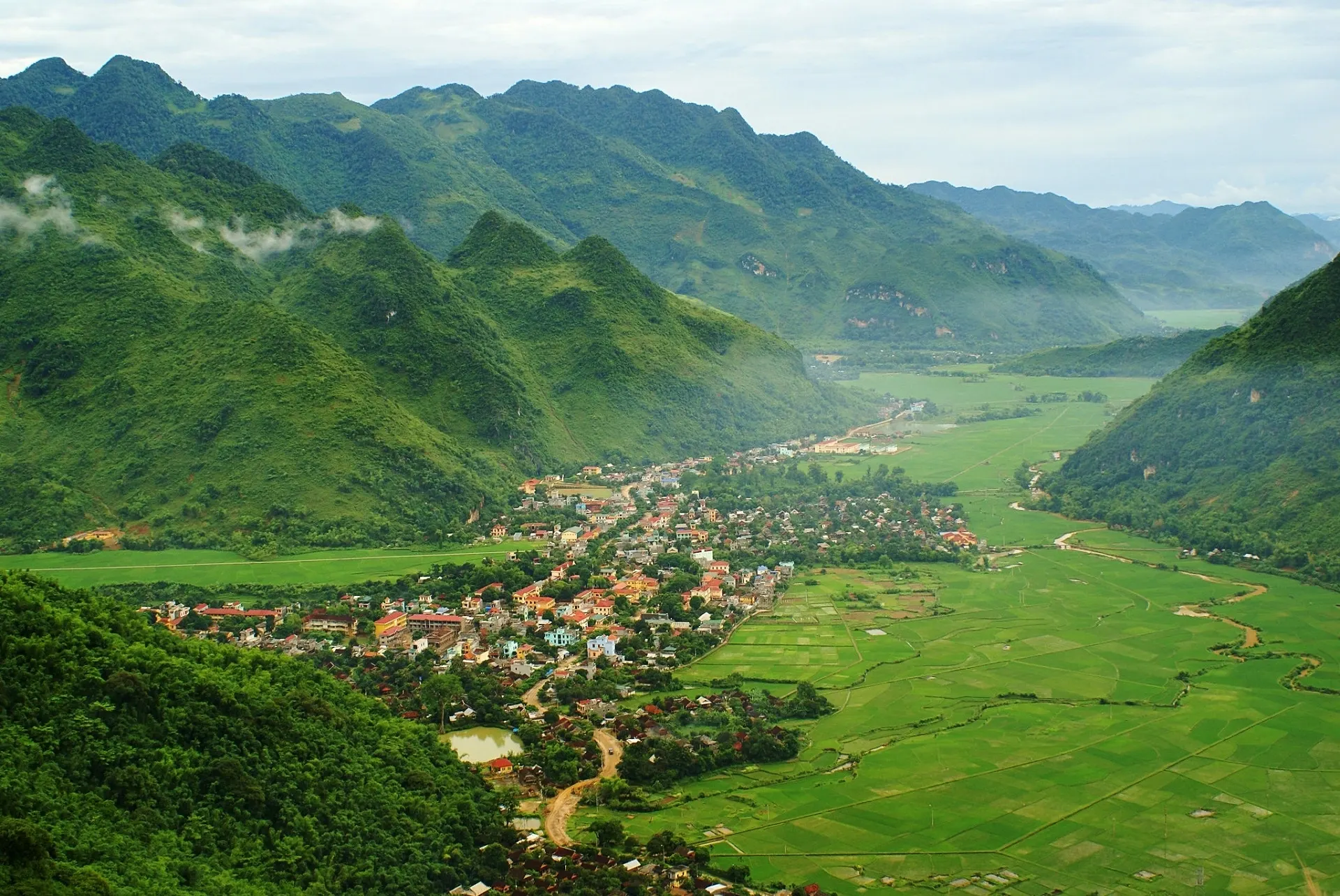 Mai Chau valley panoramic viewpoint rice paddies stilt houses sunrise Bali