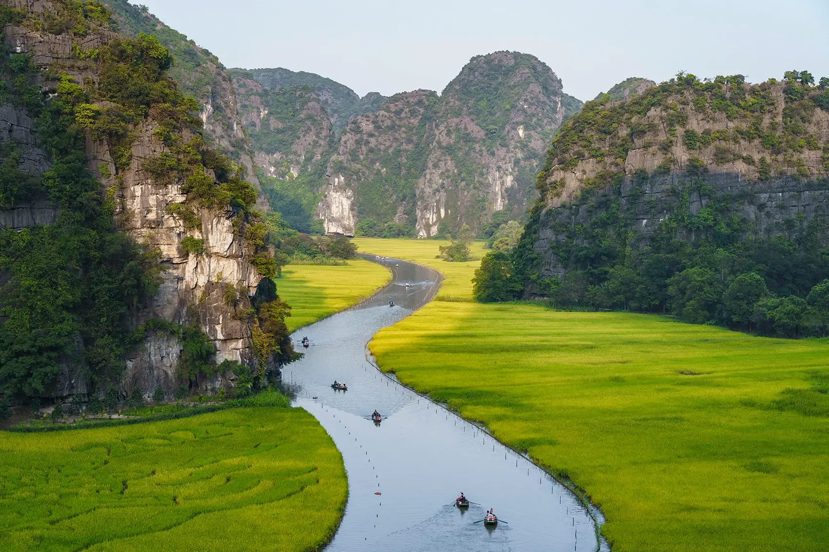 Tam Coc boat ride through rice paddies and limestone caves Bali