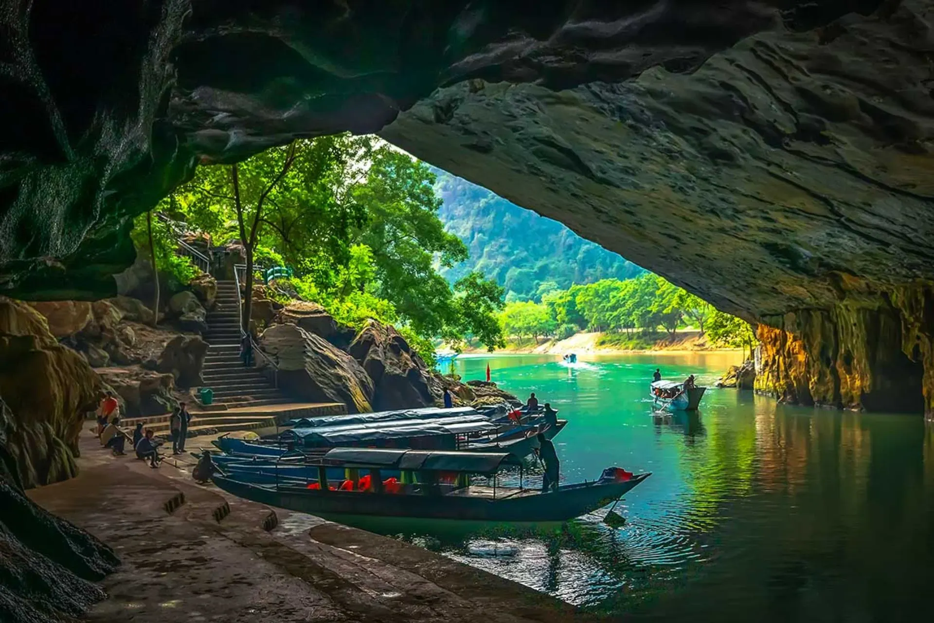 Phong Nha Cave entrance motorised wooden boat underground river Bali