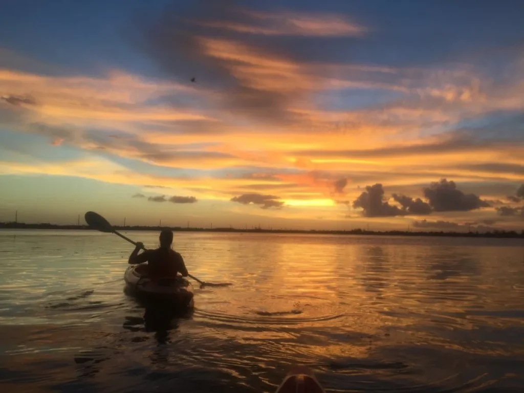 Son River kayaking sunset karst limestone peaks reflection Phong Nha Bali
