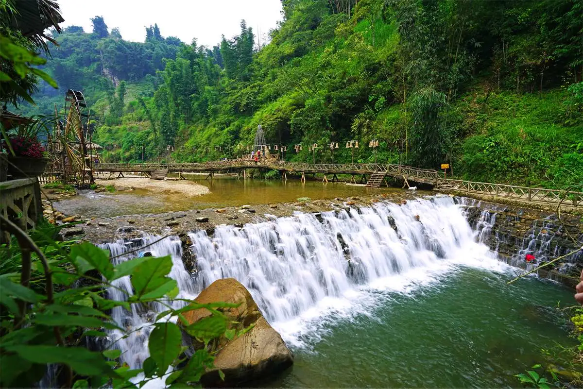 Cat Cat Black Hmong village waterfall and traditional architecture near Sapa Bali