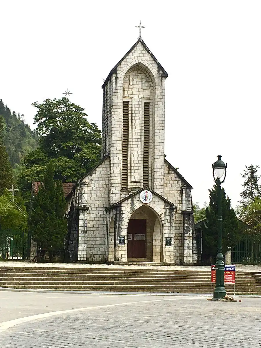 Sapa stone church French colonial and town square mountain fog Bali